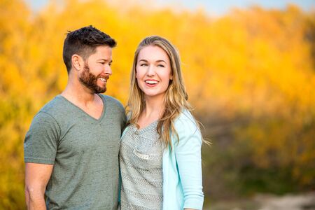 Happy young couple together outsideの写真素材