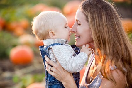 Mother and son in a pumkin patch