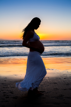Beautiful pregnant woman at the beachの写真素材