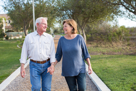 Happy senior mature couple in love outside in natureの写真素材