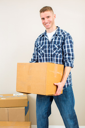 Man moving and packing boxesの写真素材