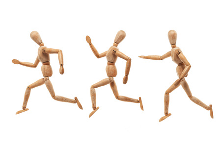 Wood men model with running and chasing pose isolated on white backgroundの写真素材