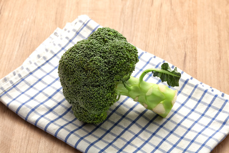 Broccoli on wood kitchen table