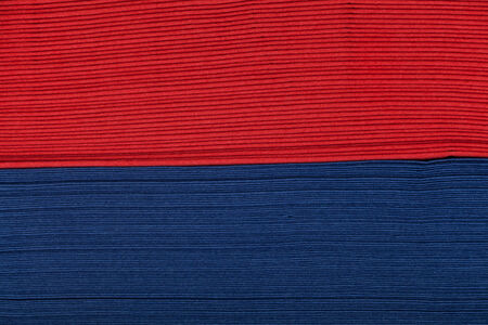 Stack of red and blue napkin paper closeup texture