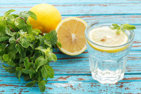 lemon soda mint fresh drink summer refreshment still life blue background wood teakの写真素材