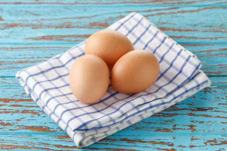 cooking eggs blush napery kitchen wood teak vintage still life backgroundの写真素材