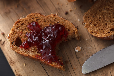 Dark multigrain bread fresh baked rustic breakfast food Whole grain homemade bakery tasty fruit jam...