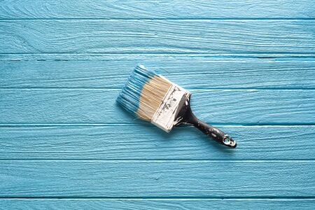 paintbrush wood coating blue tool equipment wood teak still life background vintage closeup