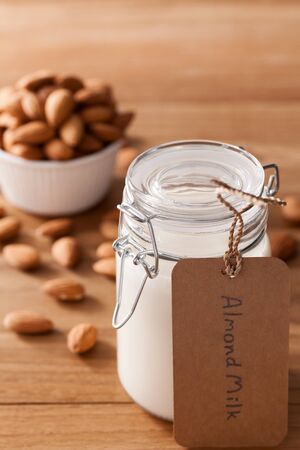 almond milk organic healthy nut vegan vegetarian drink wood teak background rustic still lifeの写真素材