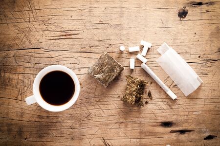 weed marijuana hashish roll wood background herb health medicine alternative coffeeの写真素材
