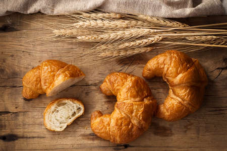 Tasty croissant still life rustic wooden background bakery breakfast brunchの写真素材