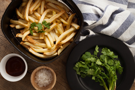 fries french ketchup herb still life salt junk fastfood background flat layの写真素材