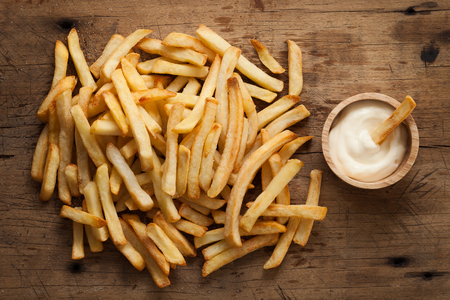 fries french sour cream still life flat lay rustic salt junk fastfood wood backgroundの写真素材