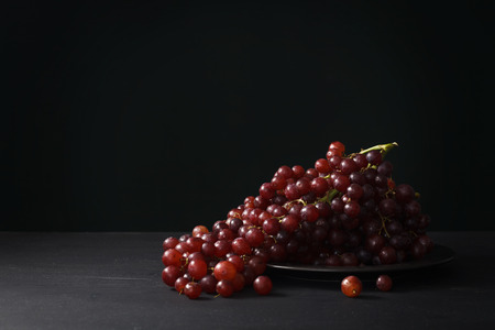 purple grapes still life black background ripe fruit wine freshの写真素材
