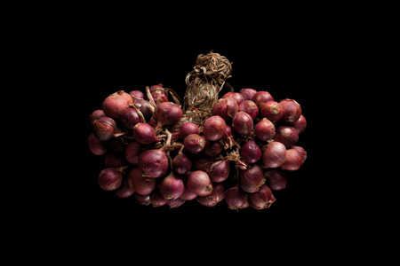 shallots still life black background onion bulb season herb vegetable ingredientの写真素材