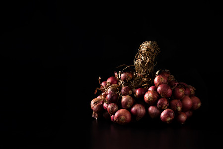shallots still life black background onion bulb season herb vegetable ingredientの写真素材