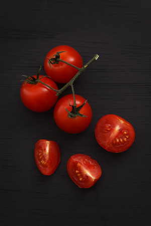 organic fresh cherry tomatoes on black board background still life vegetable raw fresh food healthyの写真素材