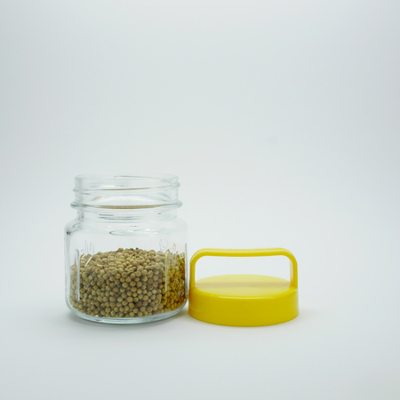 Pepper In Bottle with yellow cap on white background. 2の写真素材