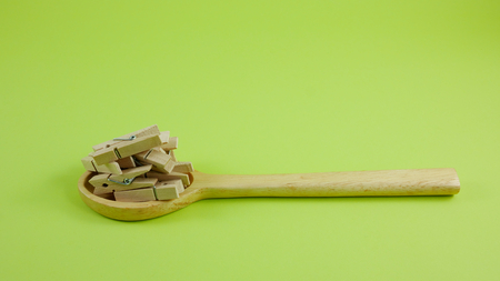 A wooden clothespin in the wooden spoon. 2の写真素材