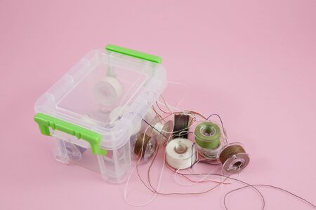 Thread spools in mini plastic box container. 3の写真素材