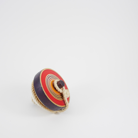 The old wooden spinning top toy with string. 1の写真素材