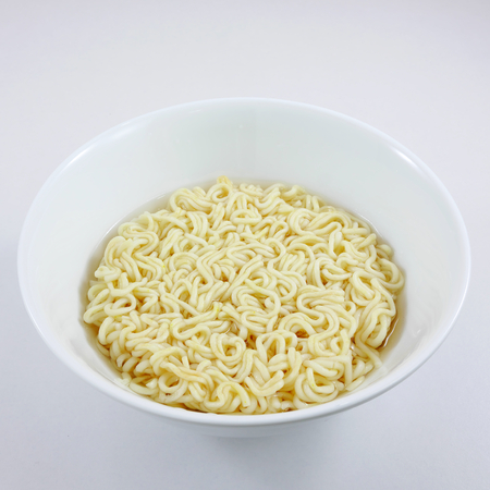 The instant noodle with boiling water in white bowl 2の写真素材