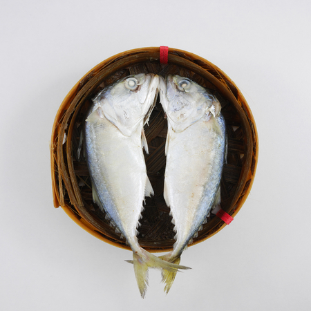 The fresh short mackerel fish in bamboo basket. 1の写真素材