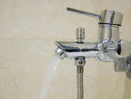 The handle pull out faucet in a bathroom. 2の写真素材