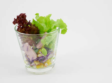 The vegetable and ham salad in the glass.の写真素材