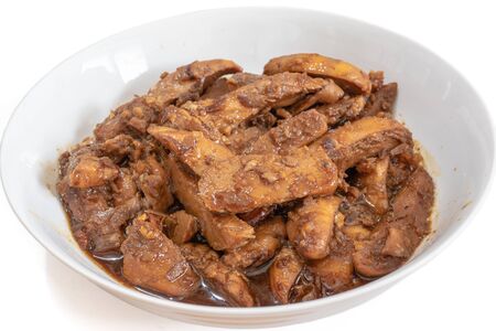 The close up of Thai fried chicken with garlic and pepper in white bowl on white background.の写真素材