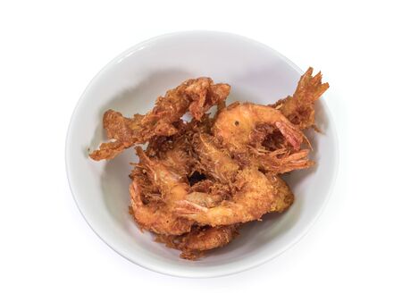 The close up of deep fried shrimp in white bowl on white background.の写真素材