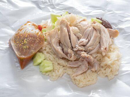 The close up of Thai chicken rice food on paper sheet.の写真素材