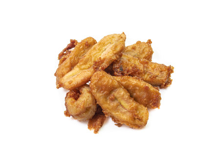 The close up of Thai tasty deep-fried sliced banana (Kluay khek) snack  vegetarian food isolated on white background.の写真素材