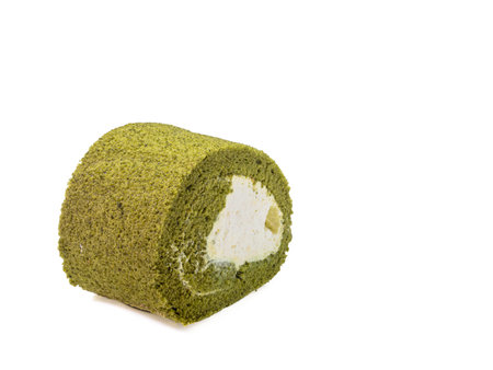 The close up of homemade matcha green tea cream roll soft cake dessert food on white background.の写真素材