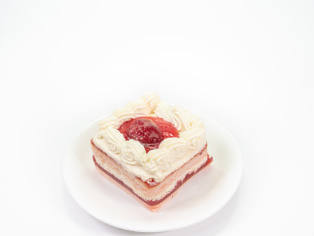 The close up of piece homemade sweet strawberry cake bakery  dessert on small dish on white background for coffee break and birthday party.の写真素材