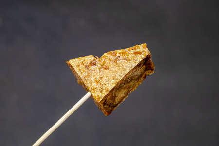 Stinky tofu, a close up of Taiwanese traditional deep fried beancurd street food at Taipei night market in Taiwan.の写真素材