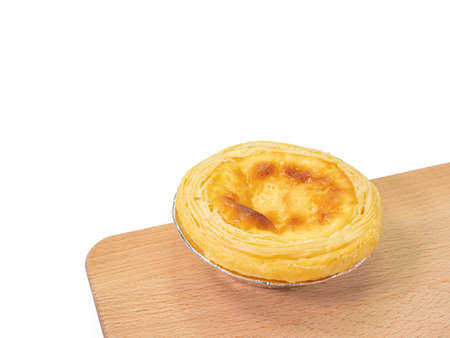 Egg tart, a close up of homemade crispy custard tart pie bakery with wooden board isolated on white...