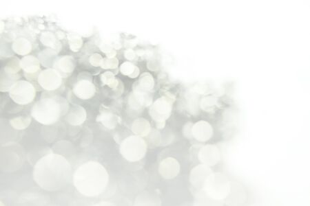 silver and white bokeh lights defocused, abstract Bokeh circles for Christmas and New year backgroundの写真素材