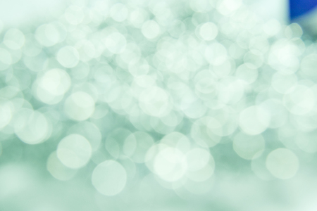 Green and white bokeh lights defocused, abstract Vintage Bokeh circles for Christmas and New year backgroundの写真素材