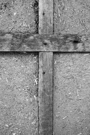Old brown wooden Old brown wooden cross on a black backgroundの写真素材
