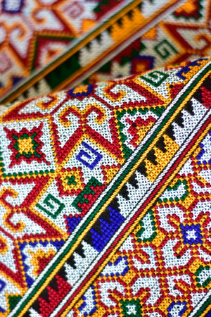 Hand-embroidered Yao Mien embroidery textile with colorful patterns, traditional tribal textile...