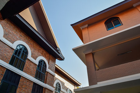 Residential building with brick wall and blue sky in background. Real estate concept.の写真素材