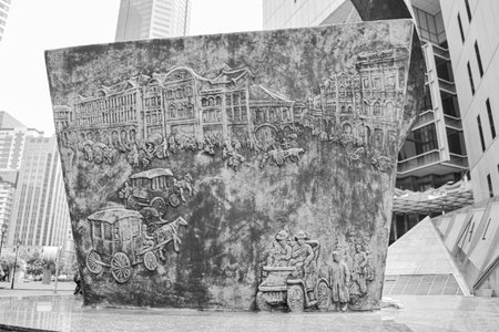 SINGAPORE - July 16, 2018: Bronze sculpture entitled "Progress and Advancement" in Raffles Place Singapore.の写真素材