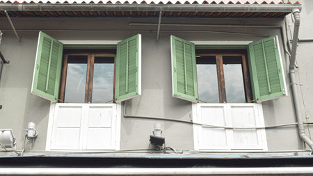 Facade of Building with Green Shutters and Windowsの写真素材