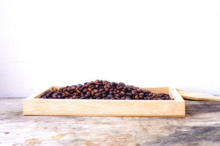 Close-Up of Roasted Coffee Beans in Wooden Boxの写真素材