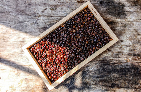 Close-Up of Roasted Coffee Beans in Wooden Boxの写真素材
