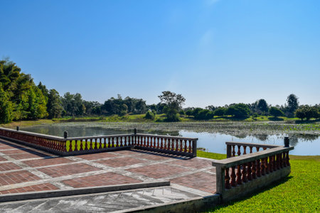 Scenic Lakeside Terrace with Clear Blue Sky and Natural Greeneryの写真素材