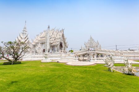 CHIANGRAI, THAILAND - APRIL 12: Unidentified travelers visit Wat Rong Khun a famous white temple at northen thailand on December 12, 2016 at Wat Rong Khun, Chaingrai, Thailand.の写真素材