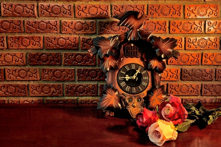 Still-Life with Coc koo clock and beautiful roses on the tableの写真素材