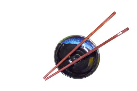Wood chopsticks and old small dishの写真素材